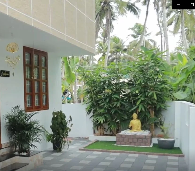 Completed Gambitz home exterior and landscaped patio in Kerala